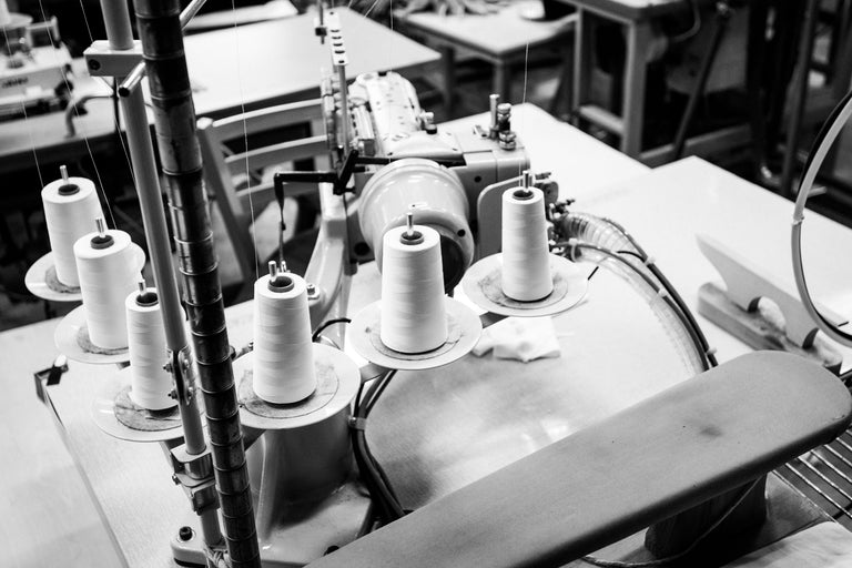 sewing machine with thread on top.