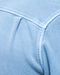 Close-up of a light blue fabric with stitching detail