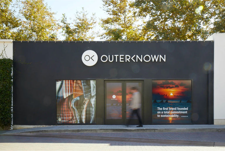 exterior of store front with Outerknown branding.